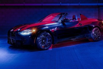 a car parked on a lot with blue and red neon lights